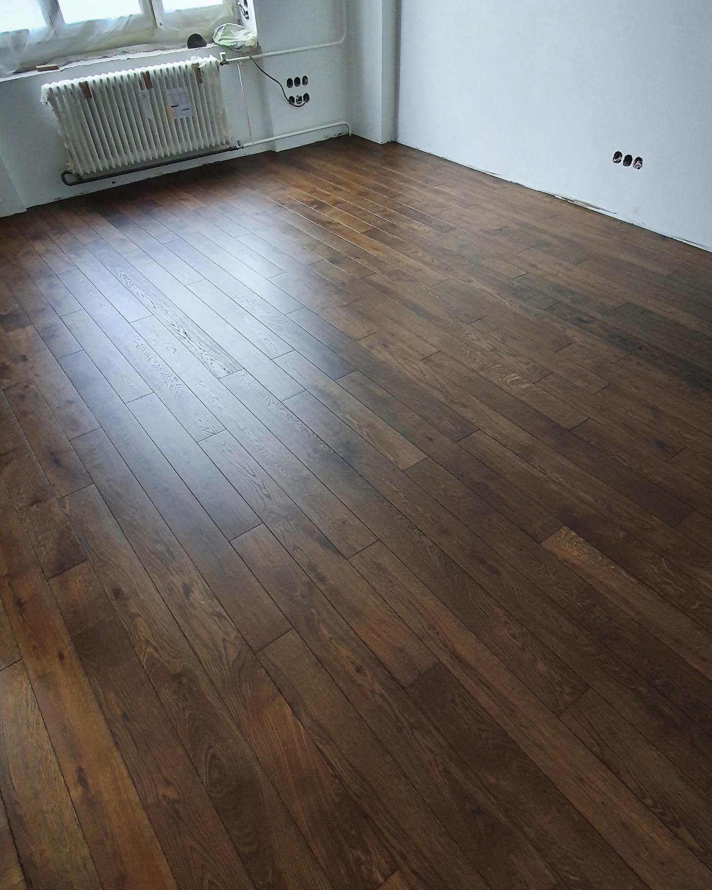 Finished solid oak flooring in a residential apartment room
