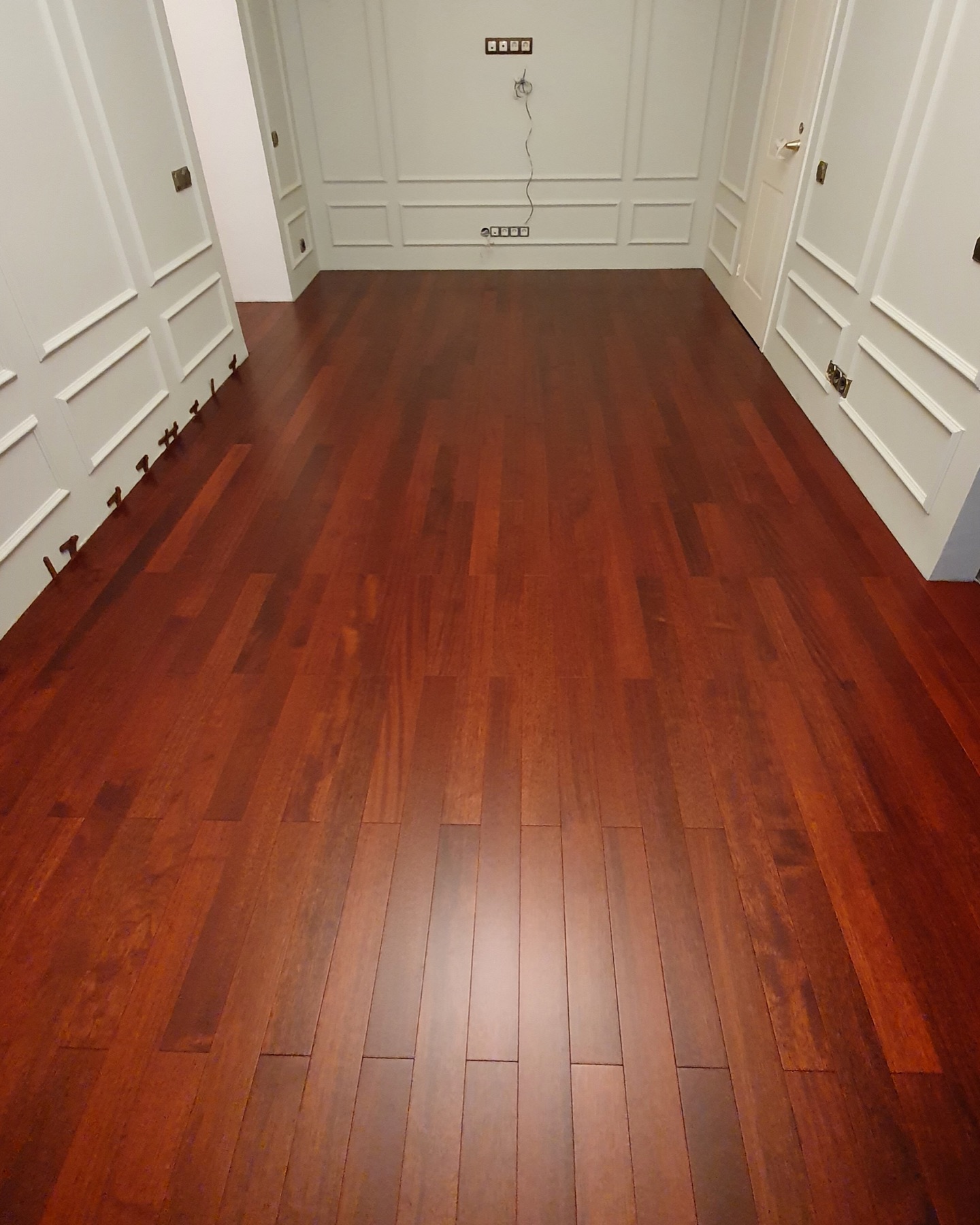 Completed merbau solid wood floor in the kitchen and dining area