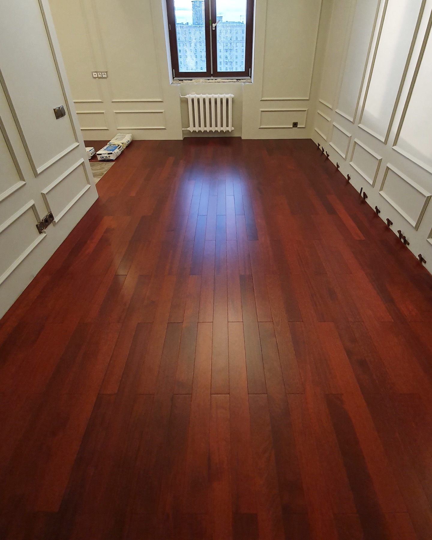 Finished merbau solid wood flooring in a kitchen and dining area