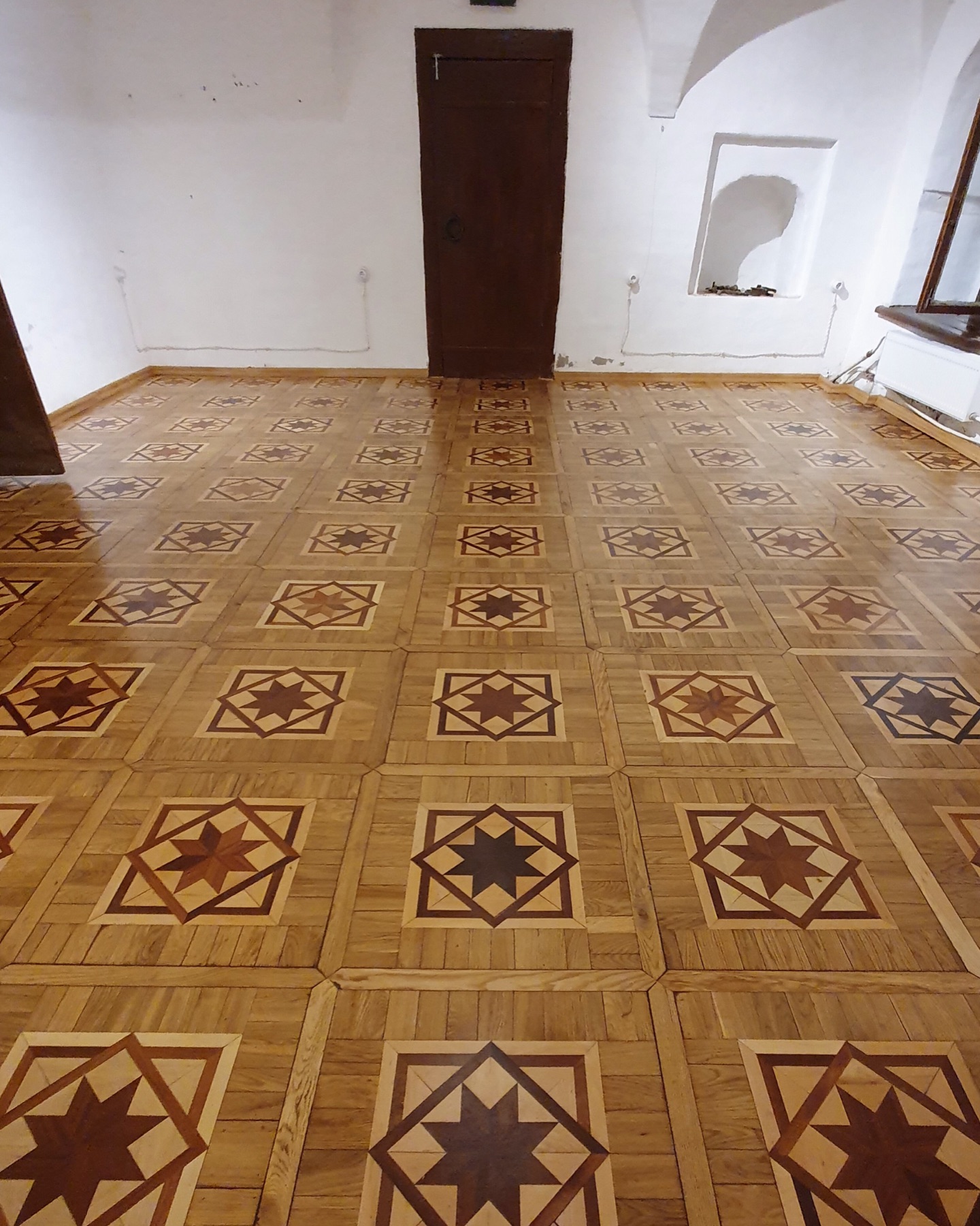 Restored mosaic parquet in a historical interior