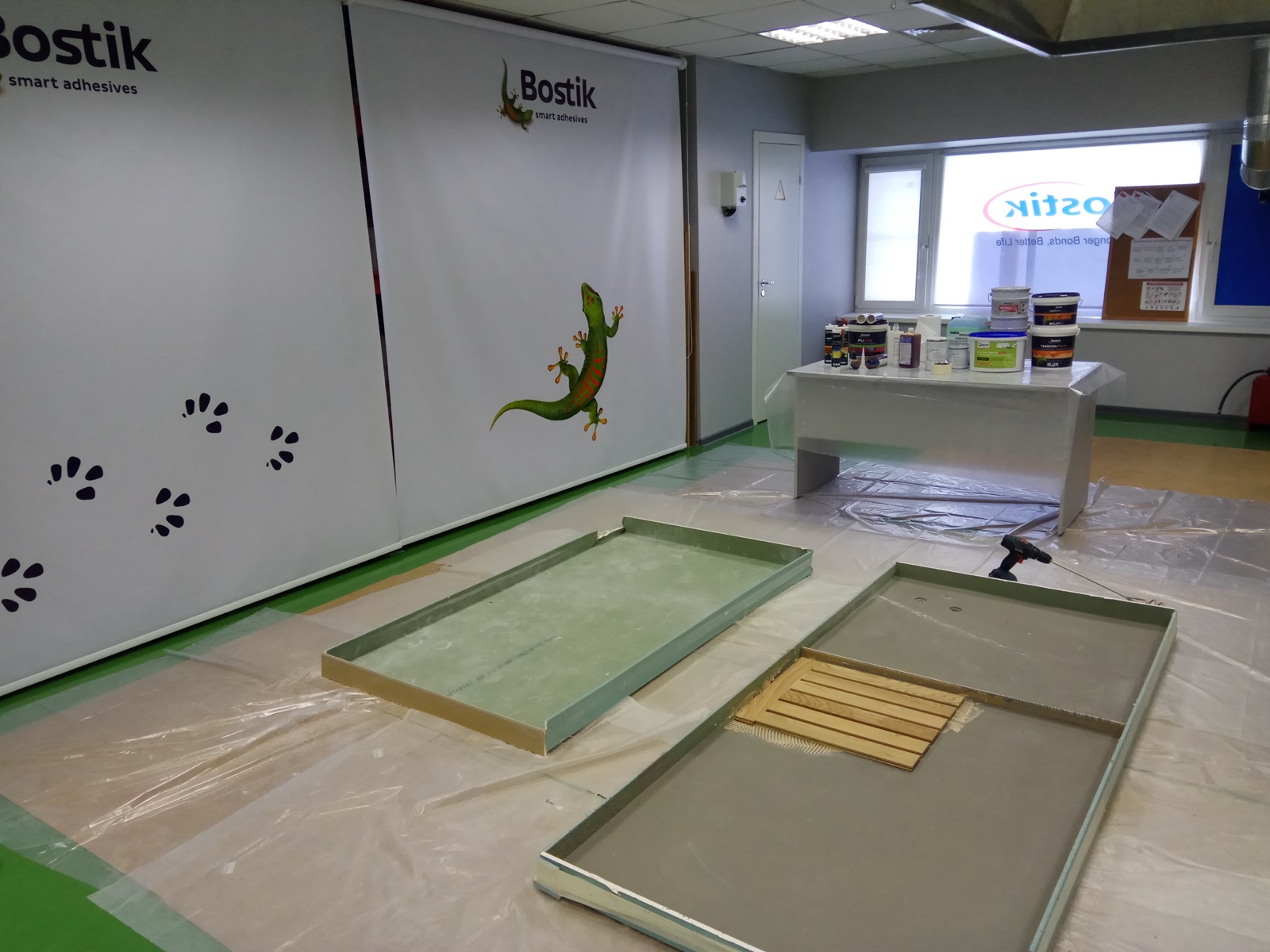 Bostik seminar setup with sample areas and product display.